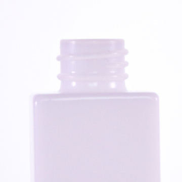 Opal white square bottle with golden dropper cap