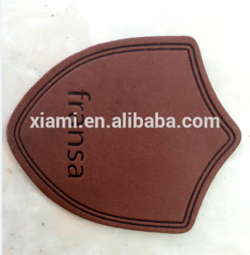 new design debossed words irregular top layer shoe leather label