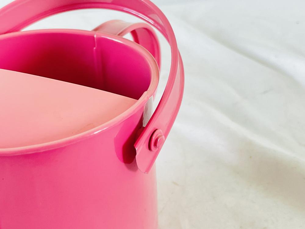 Pink metal kids watering can