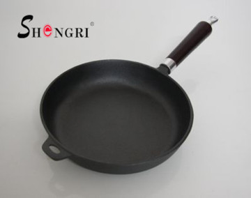 Round cast iron fry pan with wooden handle