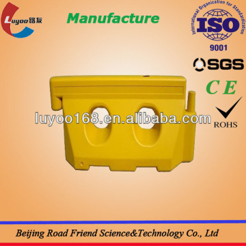 Yellow Water filled traffic barriers
