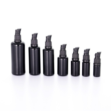 Black round shoulder glass bottle with screw cap