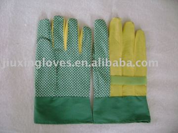 Green PVC impregnated glove with white PVC dots