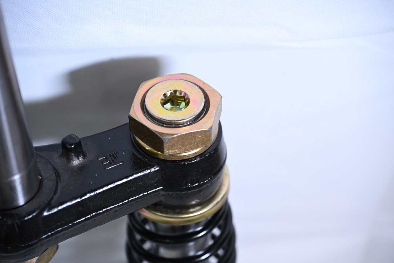 Shock absorber mounted with Motor Bike Triple Clamps on an electric tricycle front fork