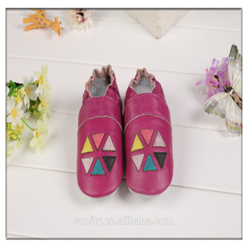 red toddler leather moccasins with hexagon pattern