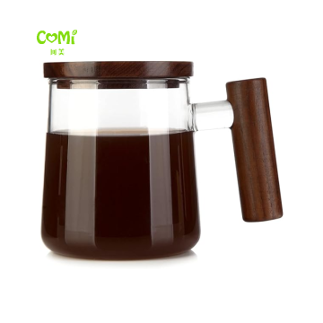 Copa de vidrio transparente con té de nuez, mango y construcción de borosilicato para té y café