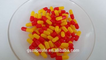 2 red-yellow pharmaceutical hard gelatin capsules