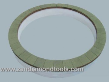 Vitrified diamond bruting wheel for grinding magnetized materials