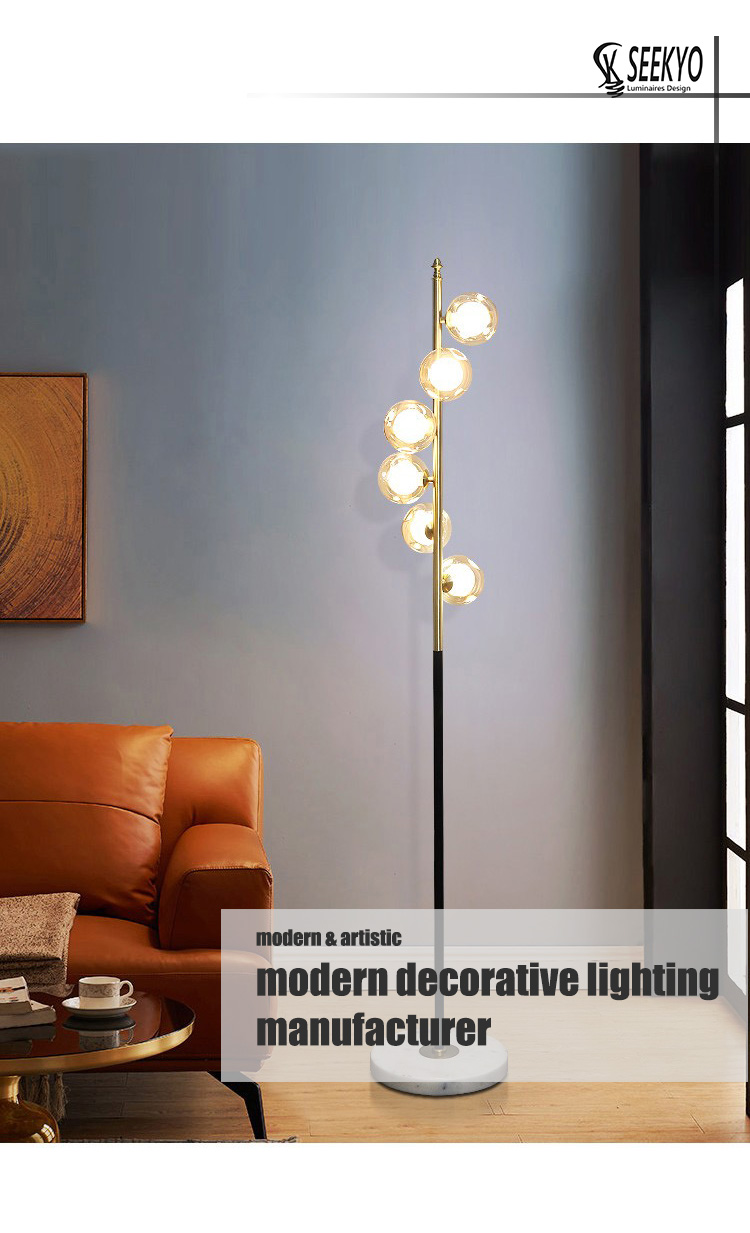 the white marble base, black gold pillar, and opal glass spheres combine to create a visually stunning and unique floor lamp that adds both style and functionality to any room.