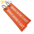 custom name remove before flight ribbon keychains