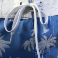 sky blue pineapple-patterned beach shorts