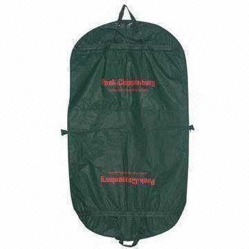 Garment bag with large front zipper pocket, zippered around bag to fold for convenient carrying