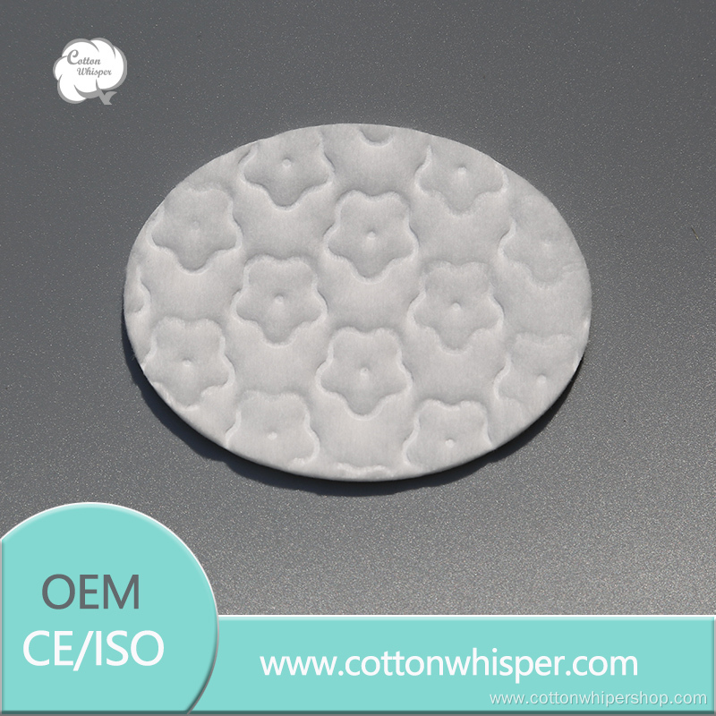 oval cotton pad with pressed plum blossom pattern