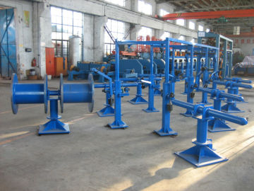 Swing arm spool pay off units for steel wire galvanizing
