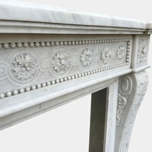 Classic White Marble Fireplace with Ornamental Floral
