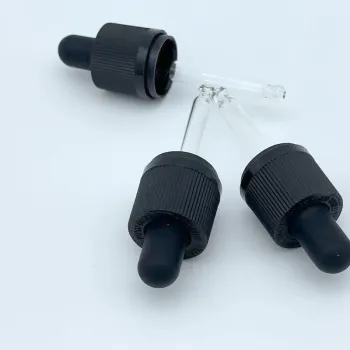 Cosmetic glass dropper plastic head