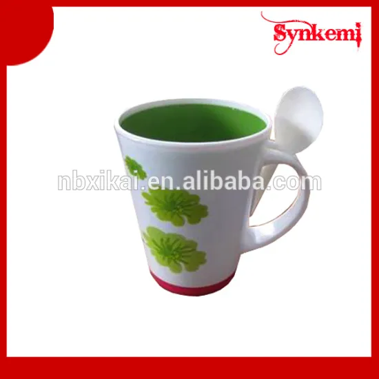 Plastic drinking cup with spoon