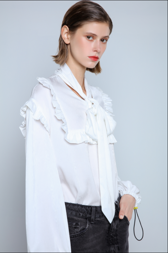 Flowing blouse with high neck and bow