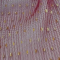 Tessuto in tulle increspato con stampa laminata a pois dorati