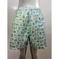 Shorts da spiaggia per icone del cartone animato verde chiaro