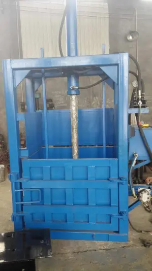 Waste paper vertical press baler strapping machine