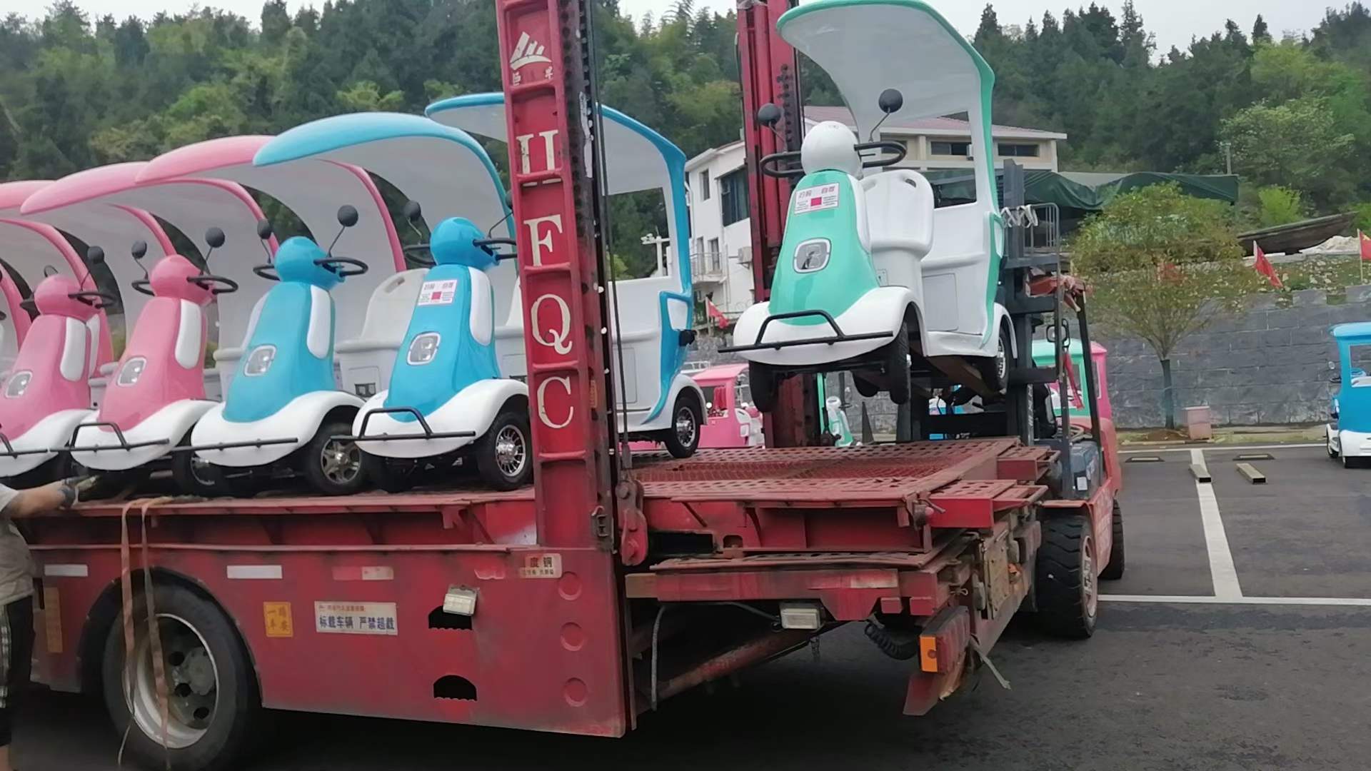 Our 2 seater mobility scooters are loaded in a long truck.