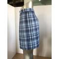 Yarn-dyed polypleated skirt in chemical fibre