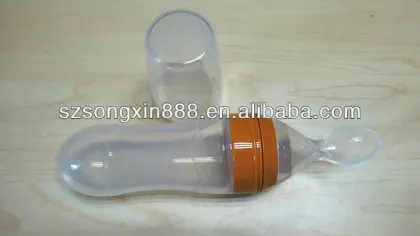 Cereal feeding by silicone baby bottle with spoon