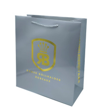 Bolsa de papel de compra de logotipo de lujo de ropa personalizada