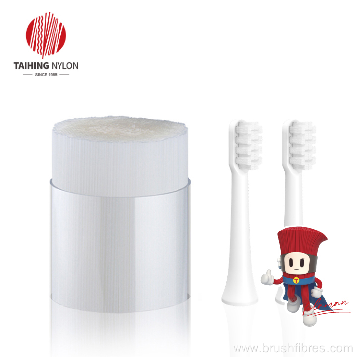 Soft PBT tapered filament for toothbrush