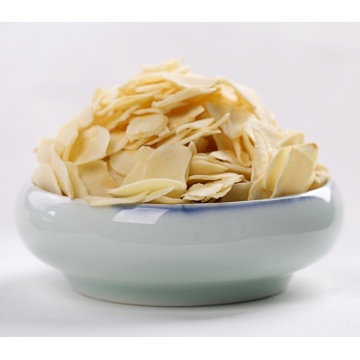 Dehydrated garlic flakes with root