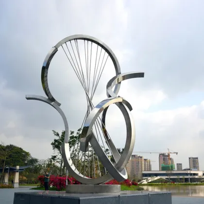 Abstract polished stainless steel pigeon sculpture