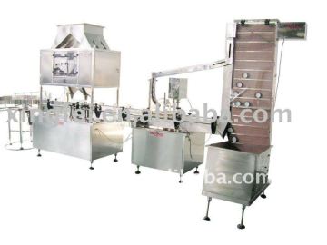 Automatic bottle filling and capping machine