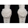 Classic Marble Statues Featuring Female Figures and Flowers