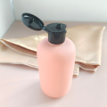 Empty HDPE shampoo bottle with flip top cap