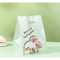 Sac d'emballage de gâteau tenu dans la main en plastique de lapin de dessin animé mignon