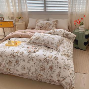 Um conjunto de cama de tampa de edredom de garota florescente