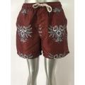 Reddish brown retro totem men's beach shorts