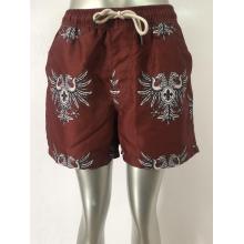 Reddish brown retro totem men's beach shorts