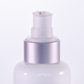 White glass lotion bottle with silver pump