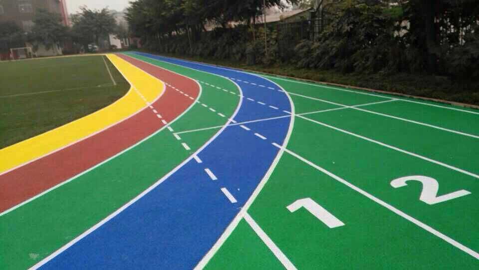 Plastic track surface construction