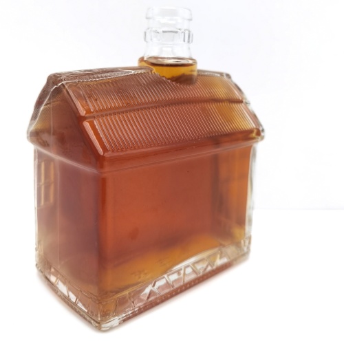 Whiskey transparent glass bottle