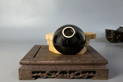 Two sets of hand holding teapot and tea set