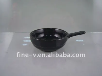 ceramic dish and pot with a handle