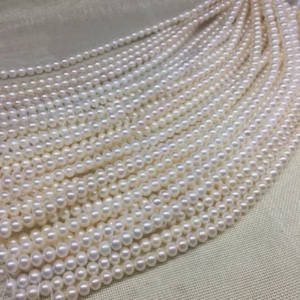 White or cream round fresh water loose water pearls with two holes for jewelry
