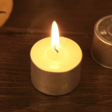 Empty tea light cups with wicks