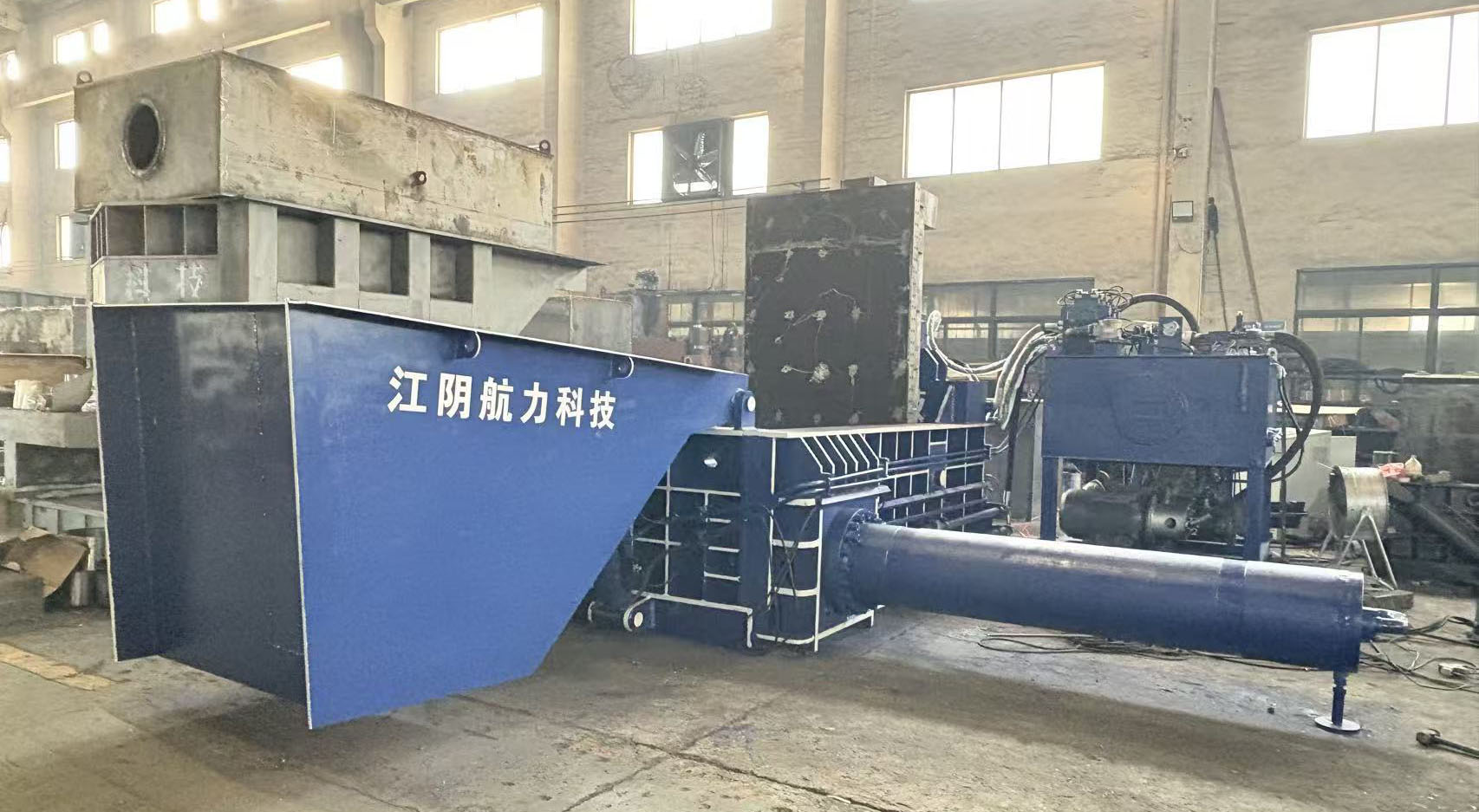 Packing machine with scrap metal hopper