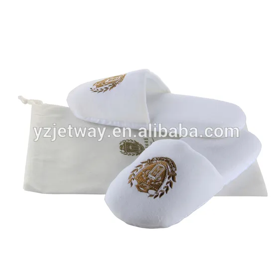 soft cotton velour slippers in hotel with dot plastic cloth