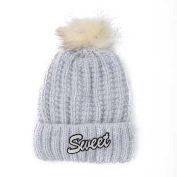 Men's knitted beanie hat with tassel