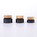 Black oblique shoulder cream jar with bamboo lid